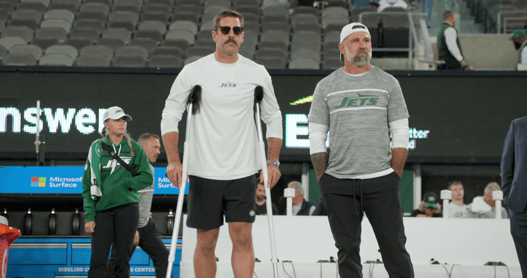 Quarterback Aaron Rodgers on the sidelines of a Jets game in "Aaron Rodgers: Enigma." (Netflix)