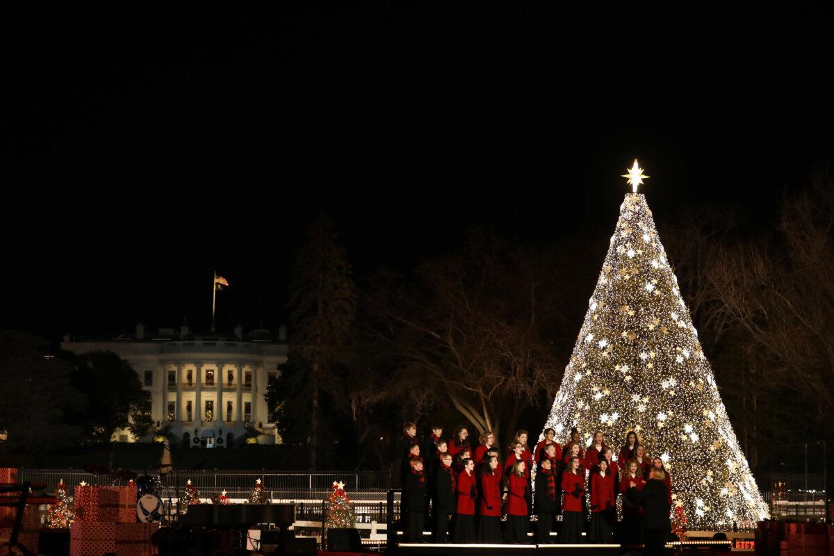 West Tennessee Youth Chorus sings in front of the lit Christmas tree and White House during ceremony for the National Christmas Tree Lighting. National Park Service. (Public Domain)