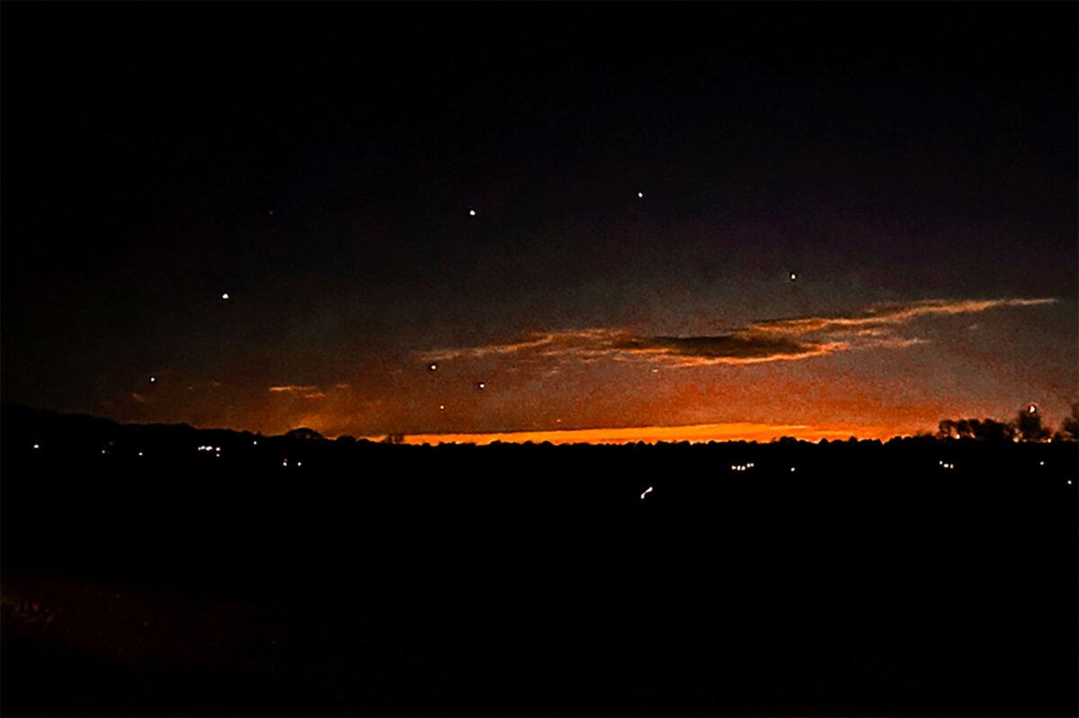 The evening sky and points of light near in Lebanon Township, N.J., on Dec. 5, 2024. (Trisha Bushey via AP)