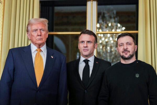 French President Emmanuel Macron (C) poses with President-elect Donald Trump (L) and Ukraine's President Volodymyr Zelenskyy (R) at the Elysee Palace, in OParis, on Dec. 7, 2024. (Aurelien Morissard/AP Photo)