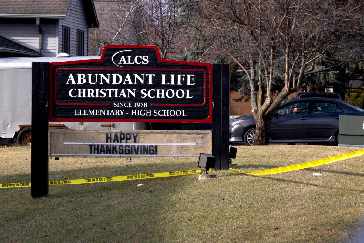 Crime scene tape stretched around Abundant Life Christian School as police continue to investigate the previous day's shooting in Madison, Wis., on Dec. 17, 2024. (Scott Olson/Getty Images)