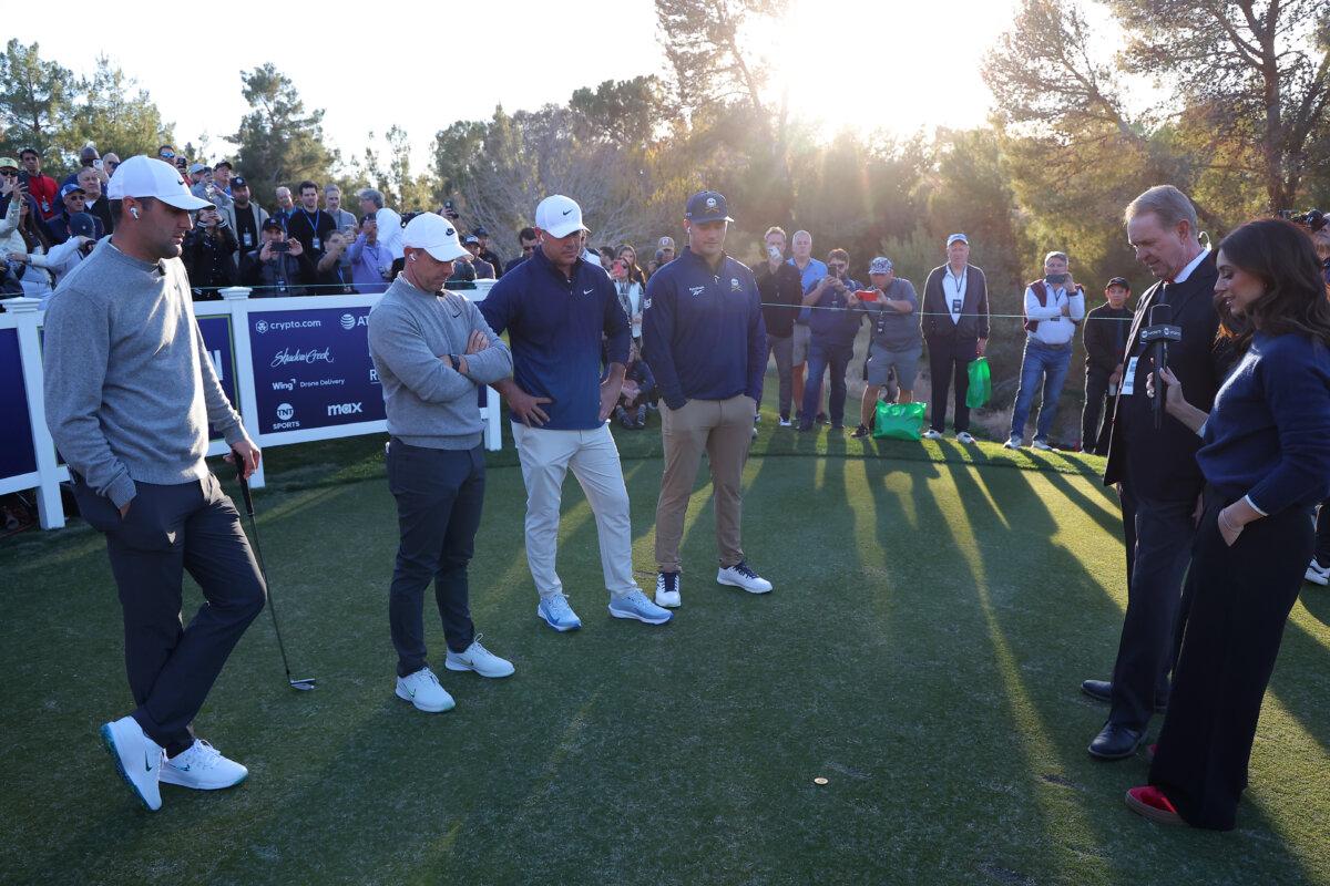 Scottie Scheffler and Rory McIlroy of the PGA Tour watch the coin flip alongside Brooks Koepka and Bryson DeChambeau of LIV Golf during "Showdown at Shadow Creek" in Las Vegas, Nev., on Dec. 17, 2024. (Kevin C. Cox/Getty Images for The Showdown)