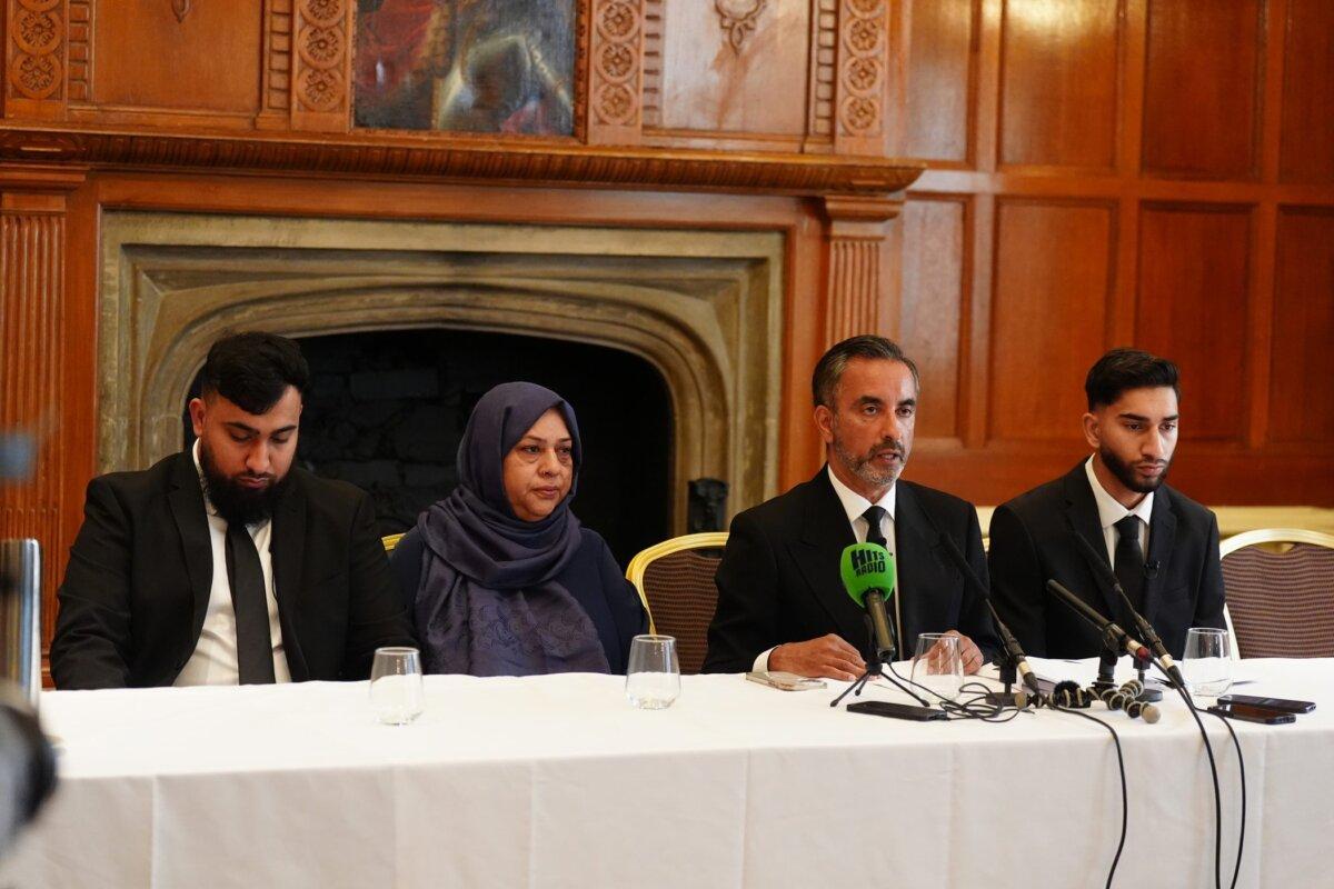 Solictor Aamer Anwar (second right) with brothers Muhammad Amaad (left) Fahir Amaaz, and their mother Shameem Akhtar, during a press conference at the Midland Hotel in Manchester, England, on Aug. 6, 2024. (Owen Humphreys/PA)
