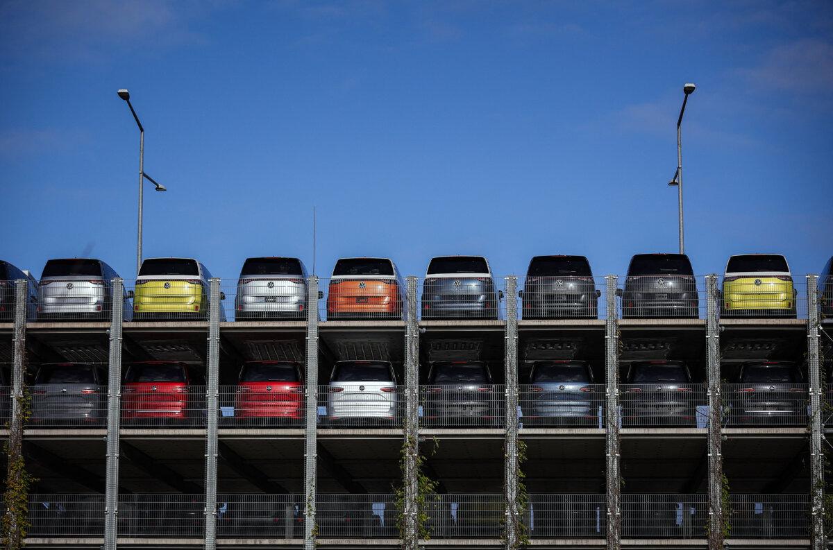New VW ID Buzz vehicles, fully electric-driven microbus cars from Volkswagen Commercial Vehicles, are seen parked before delivery at the commercial vehicle plant of German car manufacturer Volkswagen in Hanover, northern Germany, on Dec. 20, 2024. (Ronny Hartmann/AFP via Getty Images)