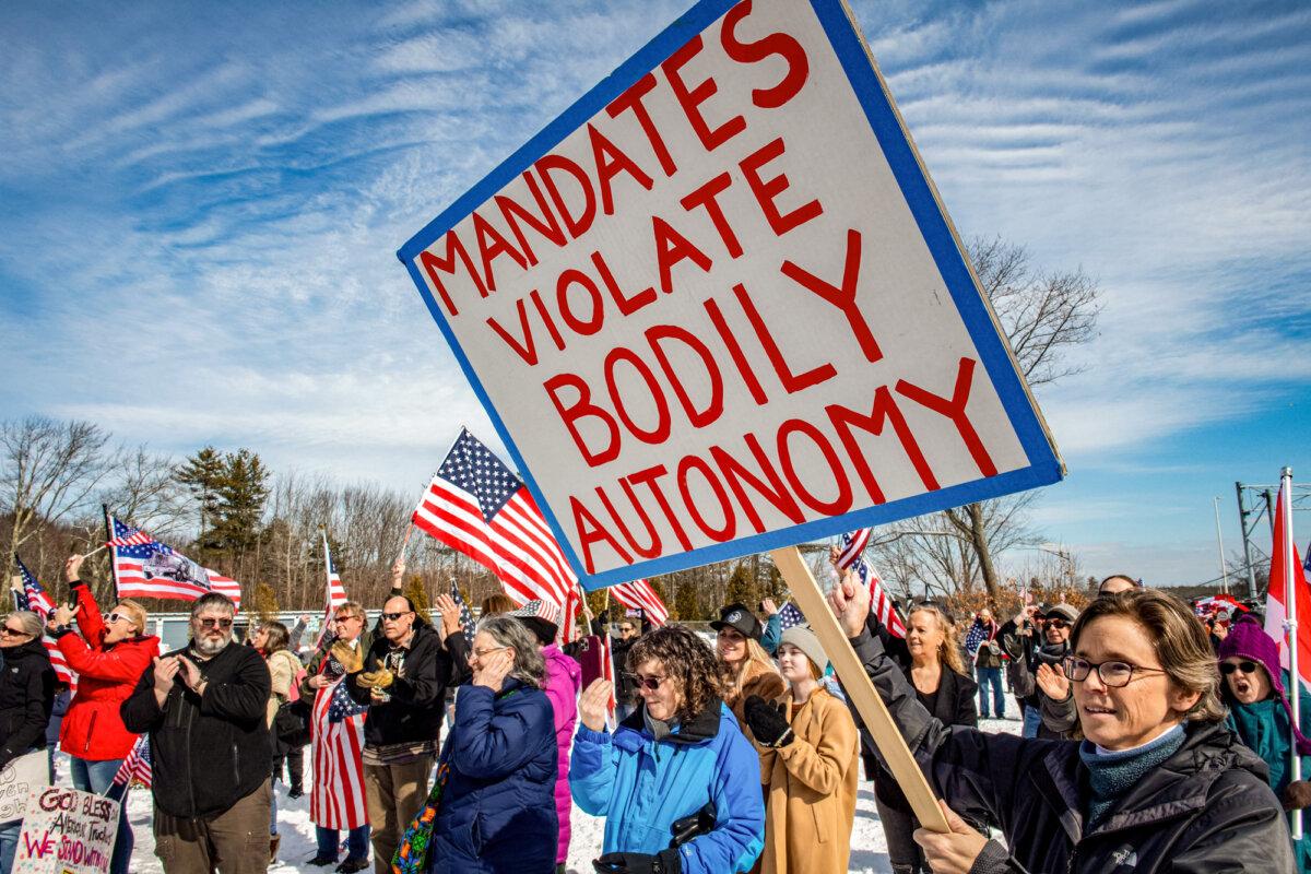 People rally against vaccine mandates and government emergency orders as part of a convoy to Washington, at an I-95 service area in Kennebunkport, Maine, on March 2, 2022. (Joseph Prezioso/AFP via Getty Images)