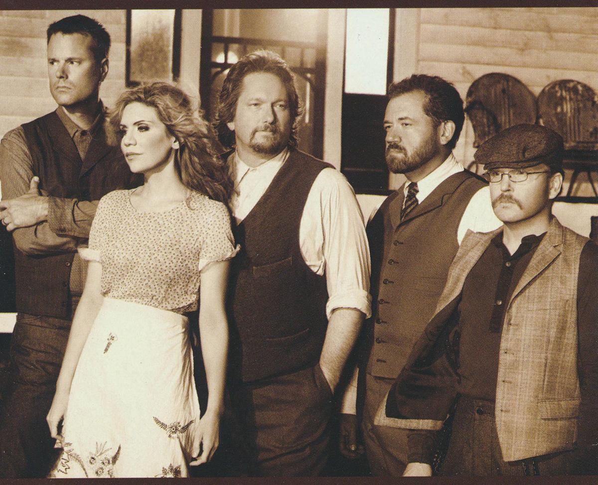 (L–R) Barry Bales, Alison Krauss, Jerry Douglas, Dam Tyminski, and Ron Block from Alison Krauss & Union Station’s 2011 album “Paper Airplanes.” Internet Archive. (Public Domain)