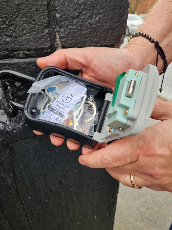 An urban geocache container is stocked with treasures and a log book. (Myscha Theriault/TNS)