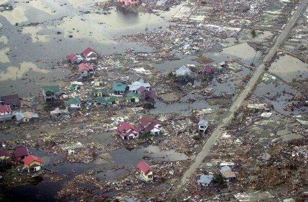 Destroyed houses are seen in this aerial view of the town of Meulaboh in Aceh Province, Indonesia, which was flattened by tidal waves, on Jan. 1, 2005. (Dudi Anung/AP Photo)
