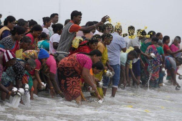 Indians offer tributes in remembrance of victims of the 2004 tsunami on the 20th anniversary of the tragedy, at Marina Beach in Chennai, India, on Dec. 26, 2024. (Mahesh Kumar A./AP Photo)