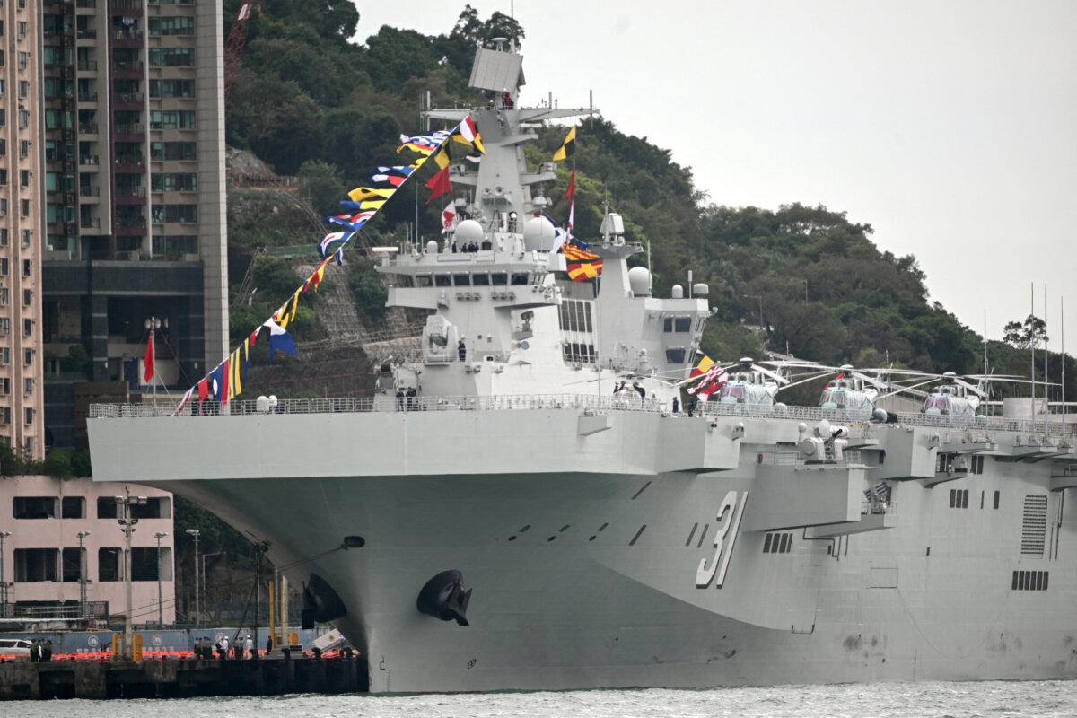 China's People's Liberation Army (PLA) Navy formation, Type 075 amphibious assault ship, Hainan, is docked at China Merchants Wharf in Hong Kong on Nov. 21, 2024. (Peter Parks/AFP)