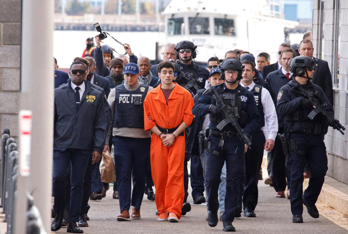 Luigi Mangione, the suspect in the murder of UnitedHealthcare CEO Brian Thompson, arrives at a helicopter pad after being extradited from Pennsylvania, in New York, on Dec. 19, 2024. (Eduardo Munoz/Reuters)