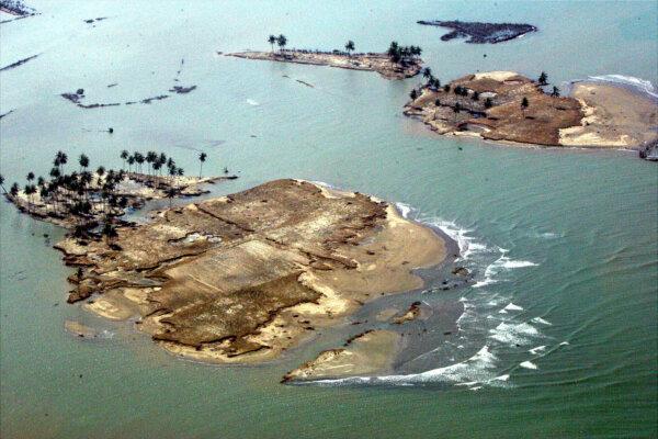 Islets are formed of what used to be part of Banda Aceh, the capital of Aceh Province in northwest of Indonesia, as seen from a commercial plane on Dec. 30, 2004 following Sunday's earthquake-triggered tsunami. (Eugene Hoshiko/AP Photo)