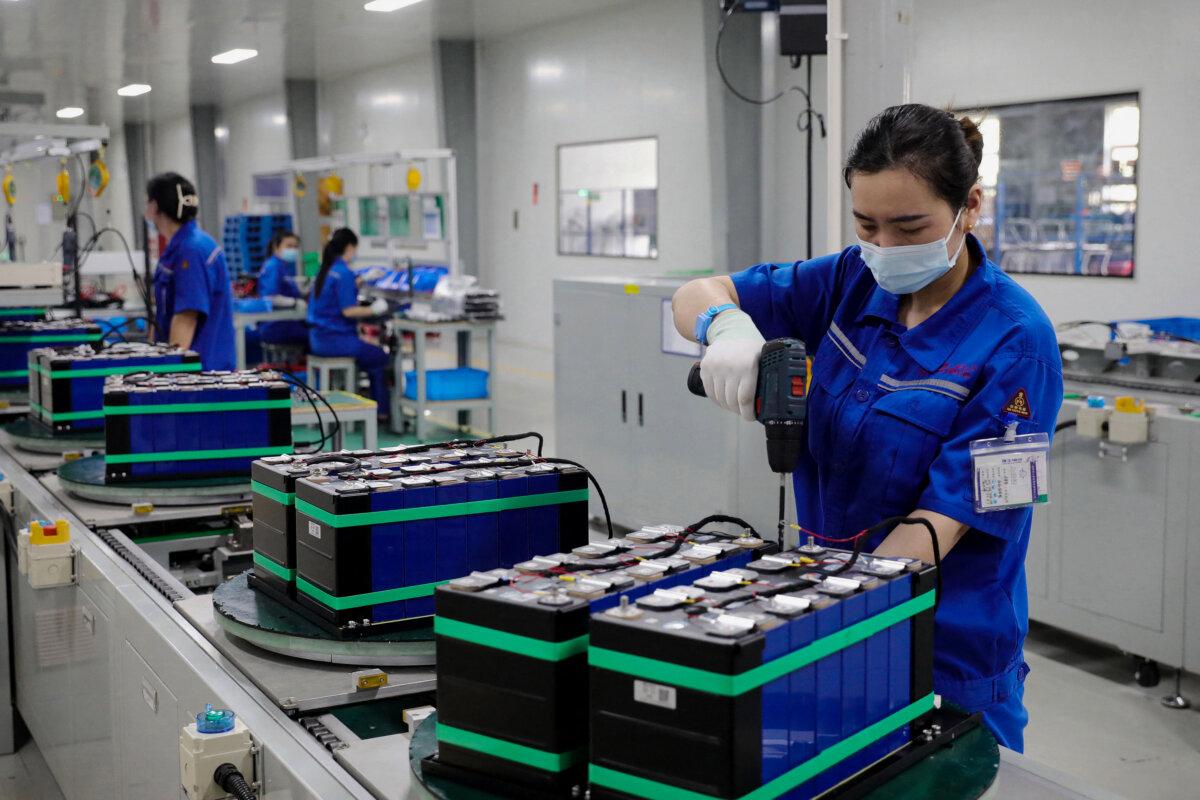 Employees work at a factory that produces lithium batteries for export in Huaibei, in eastern China's Anhui province, on June 11, 2024. (STR/AFP via Getty Images)