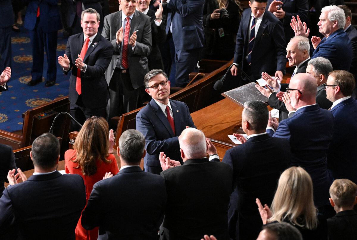 House Speaker-elect Mike Johnson (R-La.) receives applause after winning the vote for speaker of the House, during the first day of the 119th Congress in the House Chamber at the U.S. Capitol in Washington on Jan. 3, 2025. (Mandel Ngan/AFP via Getty Images)
