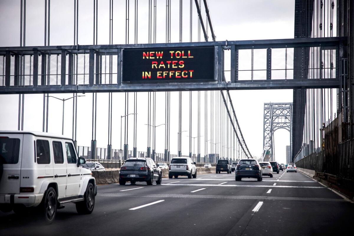 Cars pass under a congestion pricing warning sign on George Washington Bridge as congestion pricing takes effect in New York City on Jan. 5, 2024. (Kena Betancur/AFP via Getty Images)