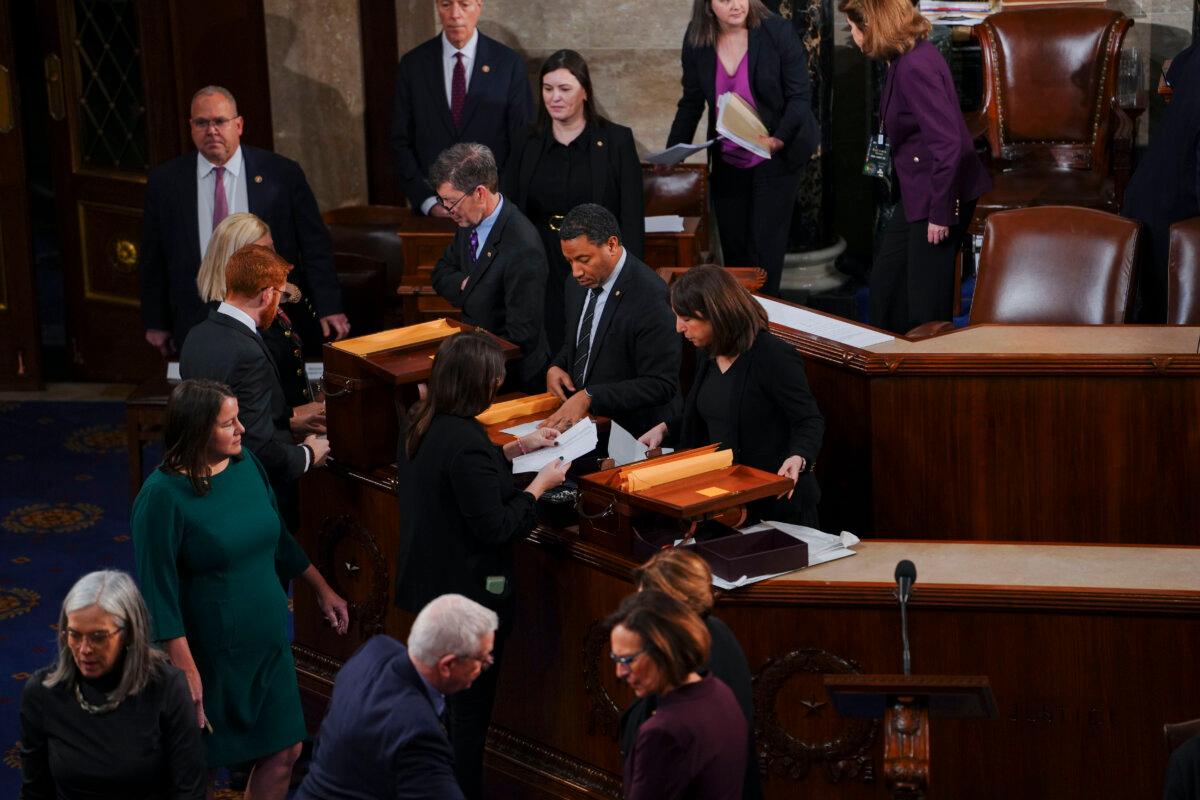 Congress Certifies Trump’s Election Victory 2 Congressional tellers and other staff congregate in the House of Representatives ahead of the certification of President-elect Donald Trump’s 2024 election victory in Washington on Jan. 6, 2025. (Madalina Vasiliu/The Epoch Times)