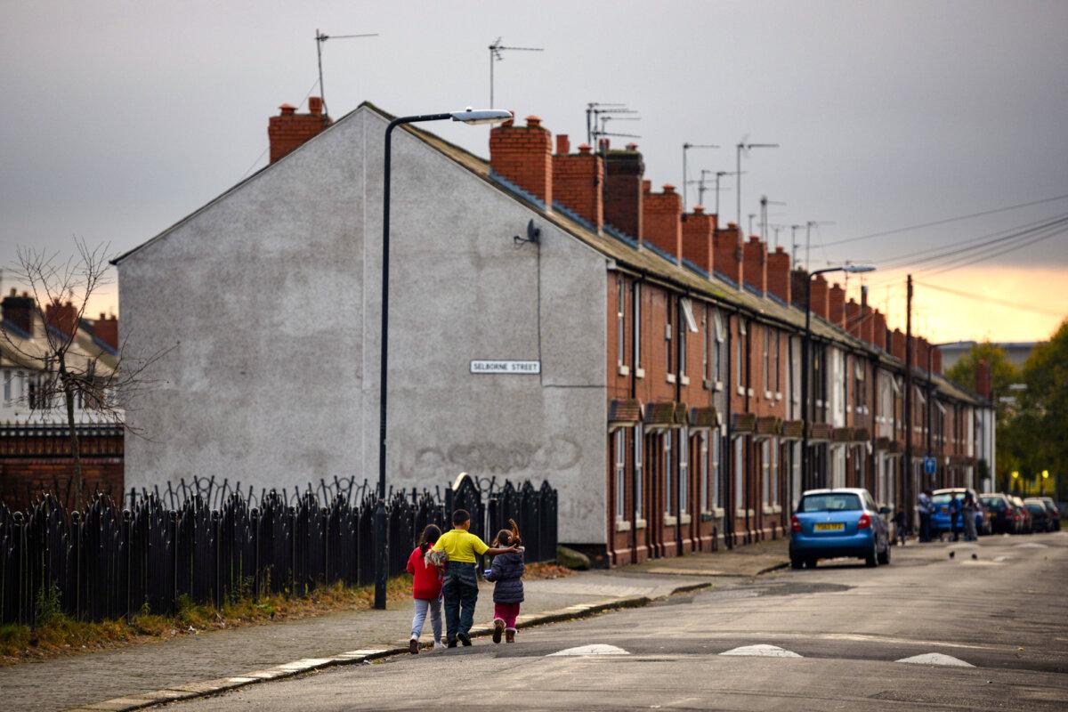 Children walk along a street in the Eastwood area of Rotherham, England, on Oct. 6, 2014. (Oli Scarff/AFP via Getty Images)