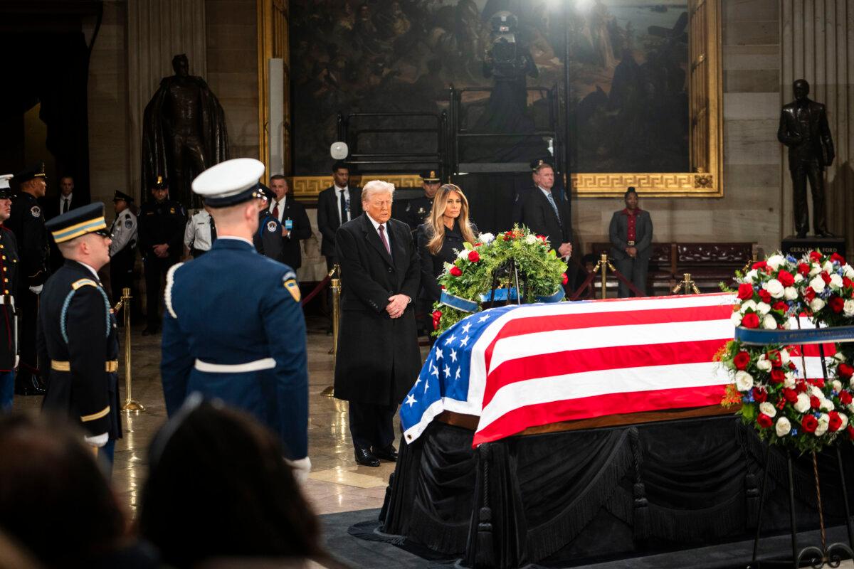 President-elect Donald Trump and his wife, Melania Trump, pay their respects to President Jimmy Carter in the U.S. Capitol Rotunda in Washington on Jan. 8, 2025. (Madalina Vasiliu/The Epoch Times)