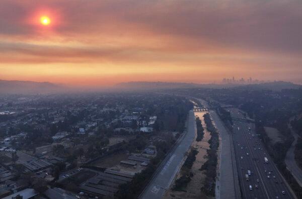 In an aerial view, wildfire smoke hangs over downtown Los Angeles amid poor air quality in the region on Jan. 9, 2025. Multiple wildfires fueled by intense Santa Ana Winds are burning across Los Angeles County. (Mario Tama/Getty Images)