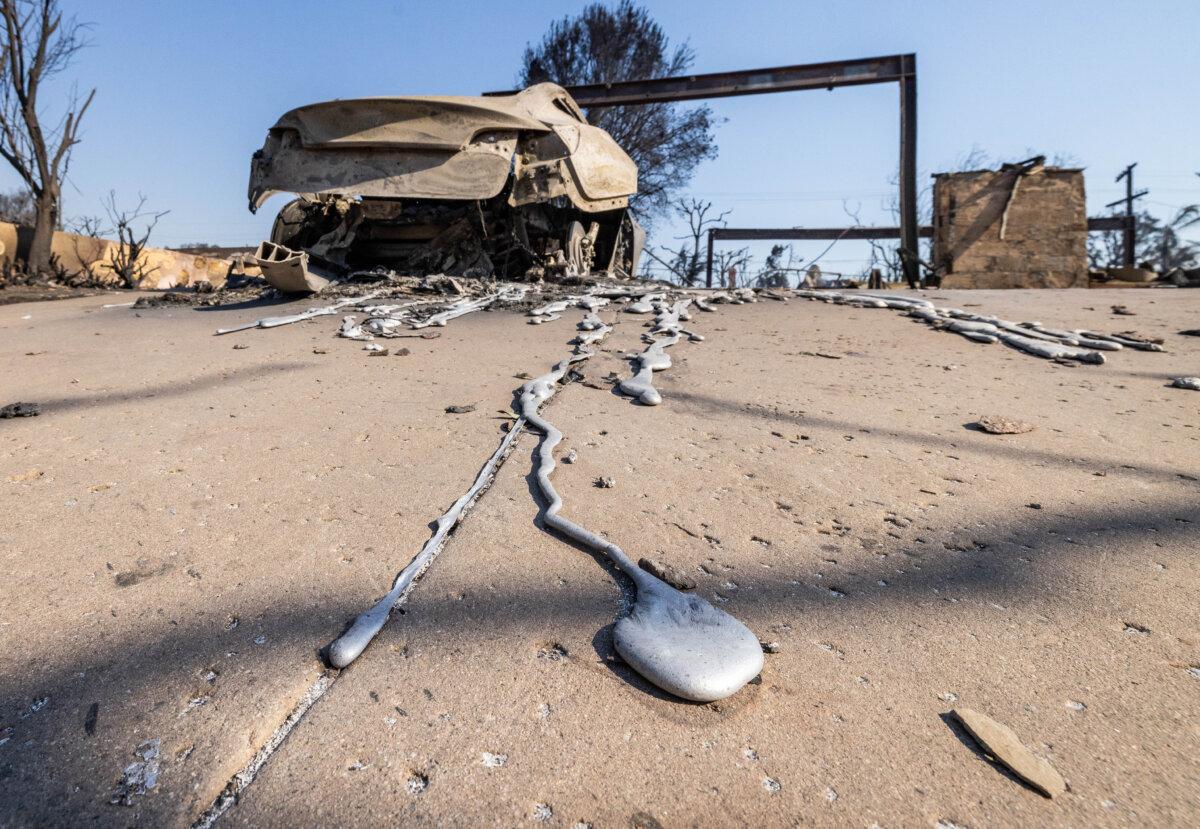 Metal residue sits melted of a car caused by the Palisades Fire near Los Angeles, Calif., on Jan. 9, 2025. (John Fredricks/The Epoch Times)