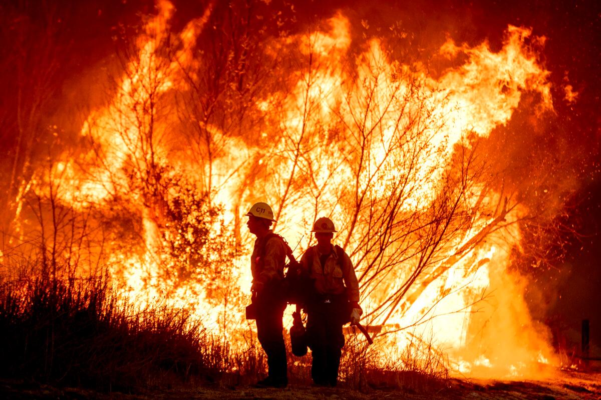 Fire crews battle the Kenneth Fire in the West Hills section of Los Angeles on Jan. 9, 2025. (Ethan Swope/AP Photo)