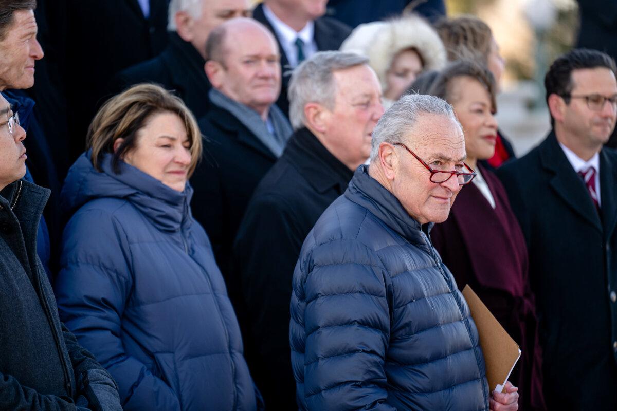 Senate Minority Leader Chuck Schumer (D-N.Y.) looks on during a press conference at the Senate steps with a caucus of Democratic Senators at the U.S. Capitol Building in Washington on Jan. 9, 2025. (Jon Cherry/Getty Images)