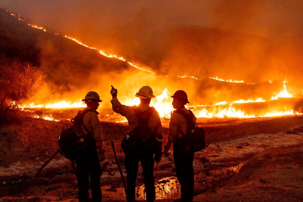 Fire crews battle the Kenneth Fire in the West Hills section of Los Angeles on Jan. 9, 2025. (Ethan Swope/AP Photo)