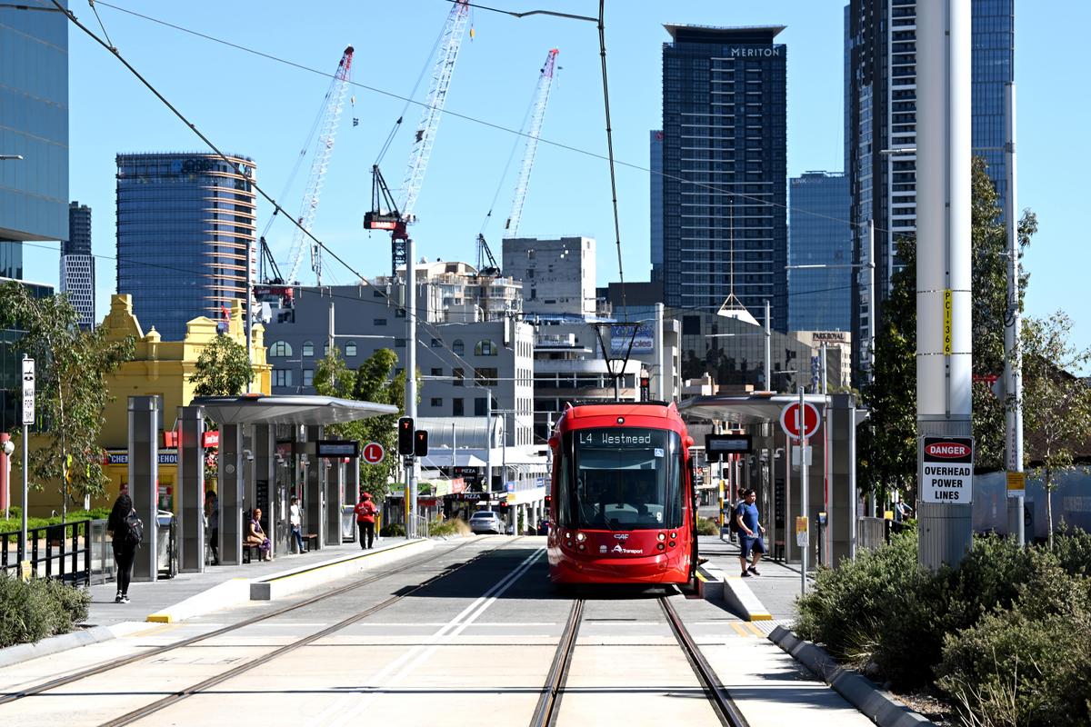 The new Parramatta Light Rail will be seen on the first day of service using Parramatta CBD in the background of Western Sydney, Australia on December 20, 2024.