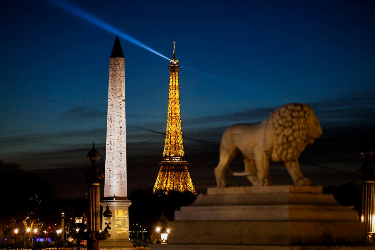 This photograph shows the Eiffel Tower, the Obelisque de Louxor (Luxor Obelisk) and the Statue du Lion at Place de la Concorde in Paris, on Jan. 13, 2025. (Ludovic Marin/AFP via Getty Images)