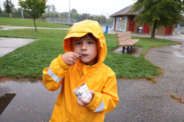 A young boy enjoys ice cream in Mich., on Sept. 28, 2024. (Scott Legato/Getty Images for MoveOn)