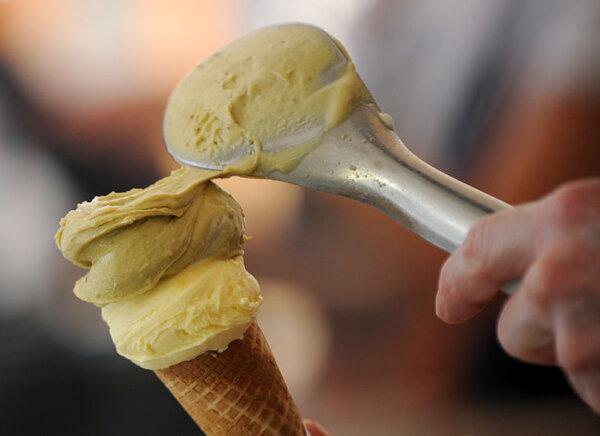 An employee serves ice cream in Milan on June 21, 2012. (TIZIANA FABI/AFP/GettyImages)