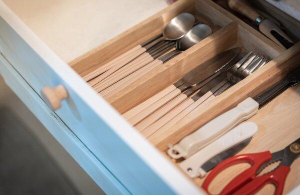 Kitchen drawer organizers are ideal for tidying up cutlery, kitchen tools, and odds and ends. (kasarp studio/Shutterstock)
