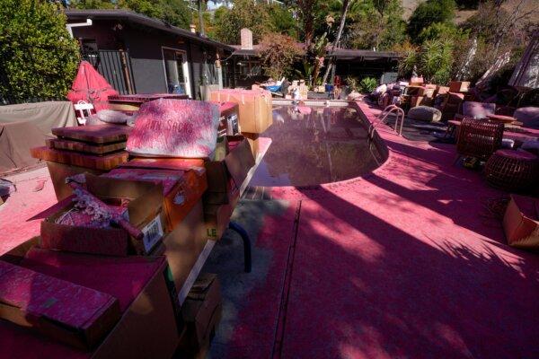 Retardant covers a backyard and pool after crews battled the Palisades Fire in Mandeville Canyon in Los Angeles on Jan. 13, 2025. (Richard Vogel/AP Photo)