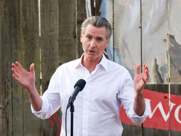 California Gov. Gavin Newsom speaks to reporters at the Davis Ranches in Colusa on Dec. 10, 2024. (Travis Gillmore/The Epoch Times)