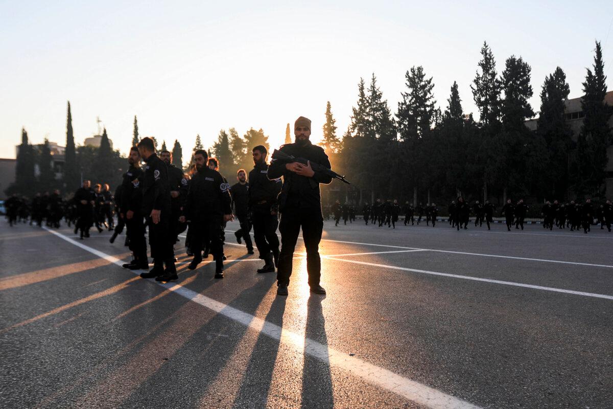 A first batch of 800 graduates of Syria's General Security forces under the country's new regime train during a graduation ceremony at the police academy headquarters in Damascus, Syria, on Jan. 14, 2025. (Bakr Alkasem/AFP via Getty Images)