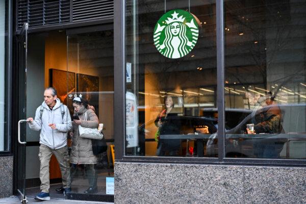 Customers are seen leaving a Starbucks in New York City on Jan. 14, 2025. Wall Street stocks mostly fell early on Jan. 13, 2025 as Treasury bond yields lingered at a high level while markets looked ahead to earnings and economic data releases. ((Photo by Angela Weiss/AFP via Getty Images)