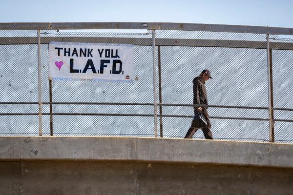 Signs of support for firefighters sit on display during the Palisades Fire seen in Santa Monica, Calif., on Jan. 14, 2025. (John Fredricks/The Epoch Times)