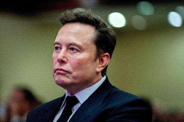 President Donald Trump listens at Tesla's CEO and X's owner, Elon Musk, on November 13, 2024 at the Hyatt Regency Hotel in Washington.