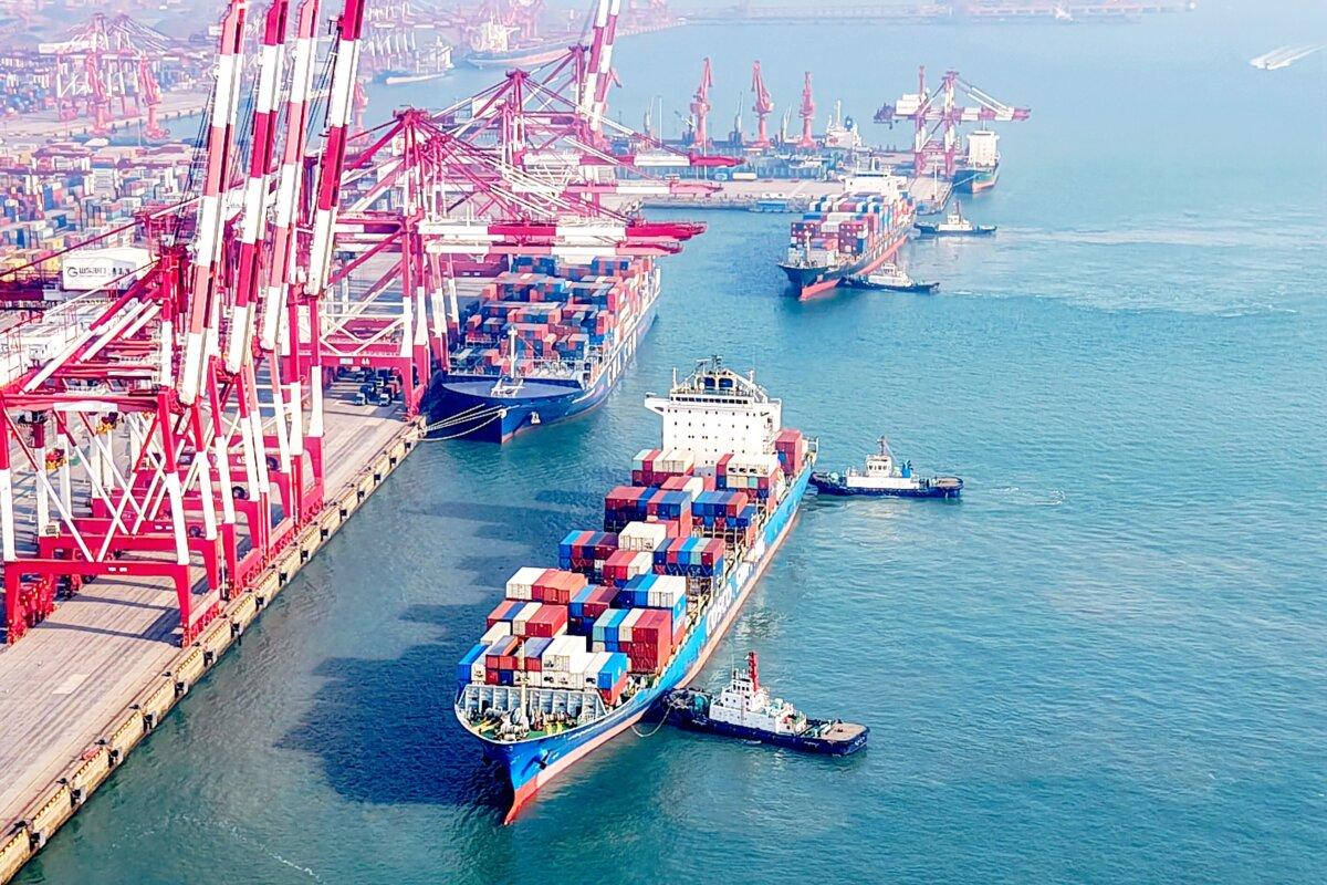 Cargo ships loaded with containers are seen berthing in Qingdao Port, east China's Shandong Province, on Jan. 13, 2025. (STR/AFP via Getty Images)