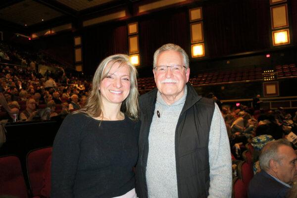 Kim Baldwin and Charles Cox enjoy a Shen Yun performance in Raleigh's Memorial Auditorium, N.C., on Jan. 18, 2025. (<span class="post_caption_credit">Maggie Xie/The Epoch Times</span>)
