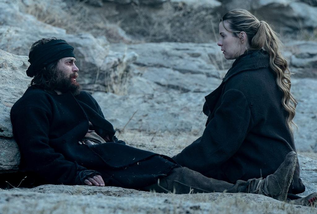 Isaac Reed (Taylor Kitsch) and Sara Rowell (Betty Gilpin), in "American Primeval." (Netflix)