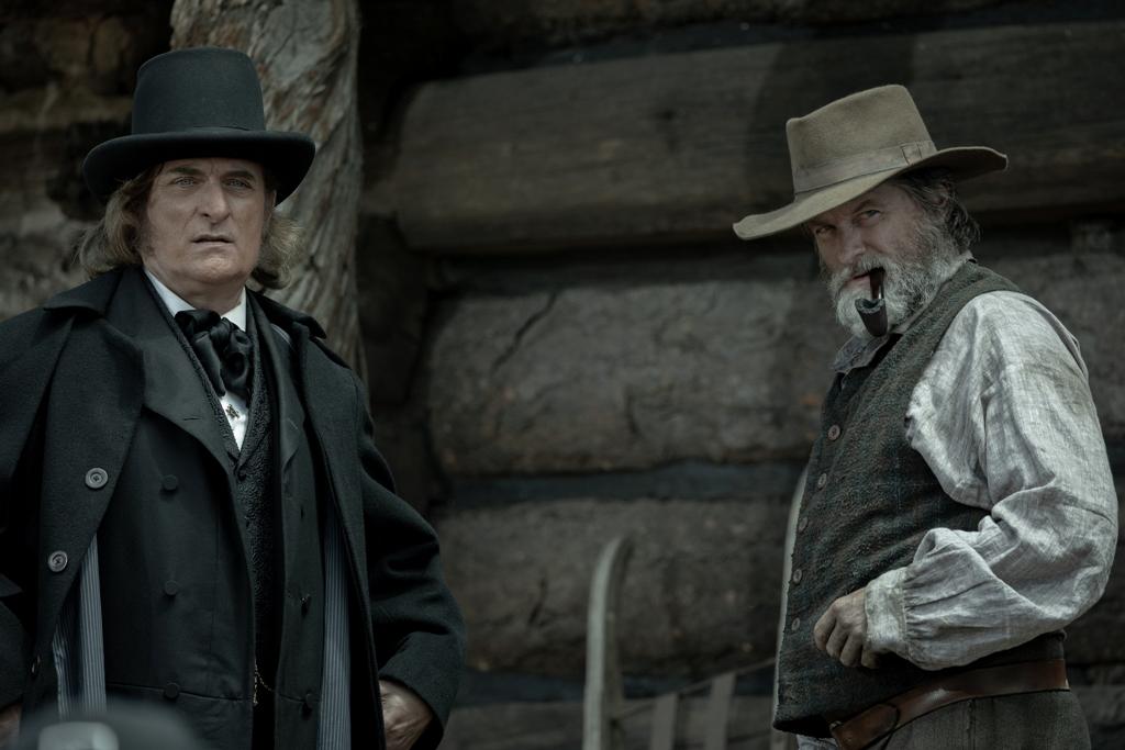 Brigham Young (Kim Coates, L) and Jim Bridger (Shea Whigham), in "American Primeval." (Netflix)
