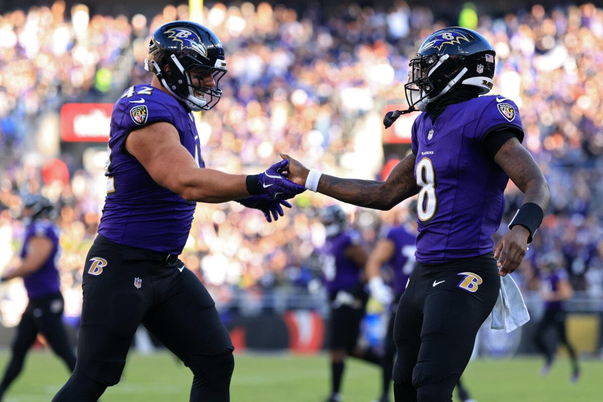 Patrick Ricard #42 and Lamar Jackson #8 of the Baltimore Ravens celebrate after their team's rushing touchdown in the third quarter of a game against the Denver Broncos at M&T Bank Stadium in Baltimore on Nov. 3, 2024. (Scott Taetsch/Getty Images)
