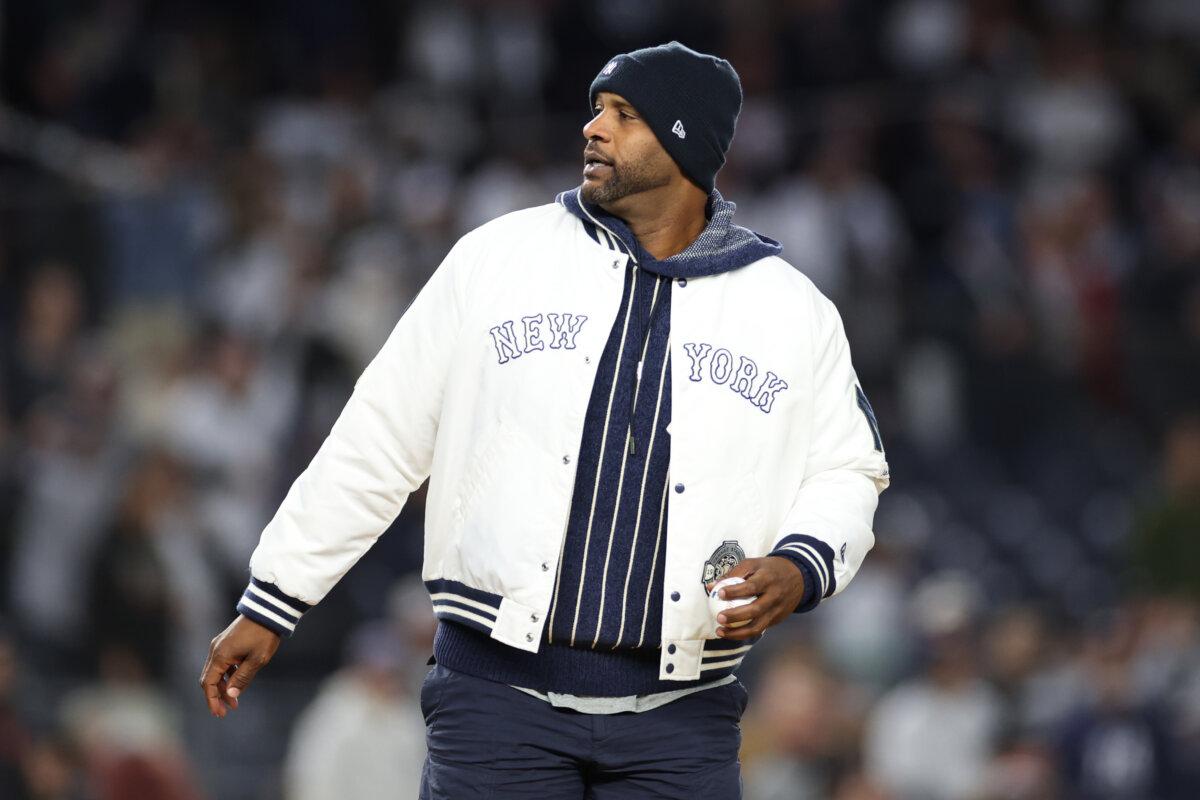 CC Sabathia throws out the ceremonial first pitch ahead of Game One of the American League Championship Series between the Cleveland Guardians and the New York Yankees at Yankee Stadium in New York City on Oct. 14, 2024. (Sarah Stier/Getty Images)