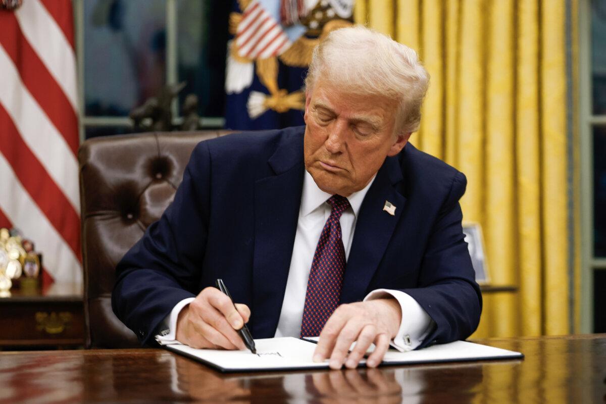 President Donald Trump signs executive orders in the Oval Office of the White House on Jan. 20, 2025. (Anna Moneymaker/Getty Images)