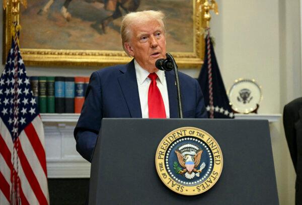 President Trump speaks in the Roosevelt Room at the White House on Jan. 21. (Jim Watson/AFP via Getty Images)