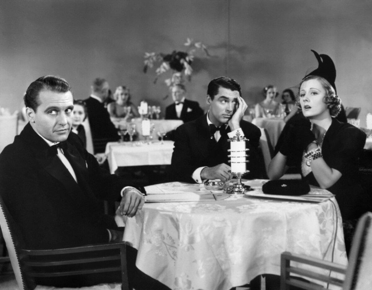(L–R) Dan Leeson (Ralph Bellamy), Jerry Warriner (Cary Grant), and Lucy Warriner (Irene Dunne) out on the town, in “The Awful Truth.” (Columbia Pictures/MovieStillsDB)