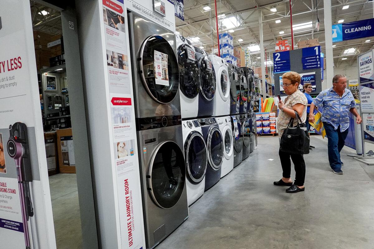 A customer looks at washers and dryers on display at a Lowe's Home Improvement store in Miami on June 27, 2022. (Joe Raedle/Getty Images)