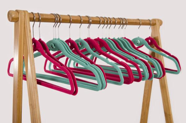 Thin velvet hangers allow more clothing to be hung comfortably. (luanateutzi/Shutterstock)