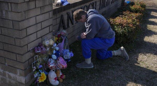 On January 23, 2025, Christillain Water prays for someone in a prayer monument for the victims of shooting at Antiochia High School in Nashville, Tennessee (George Walker IV/AP photo)